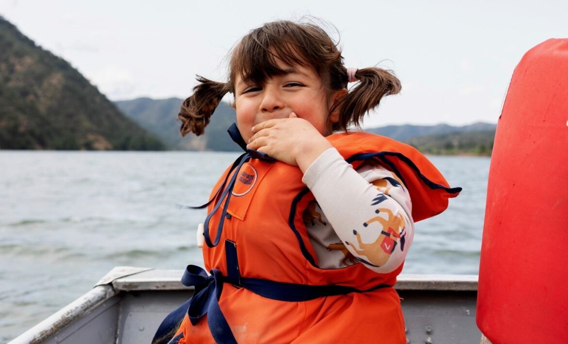 Little-girl-sitting-on-boat-back-view-1.jpg